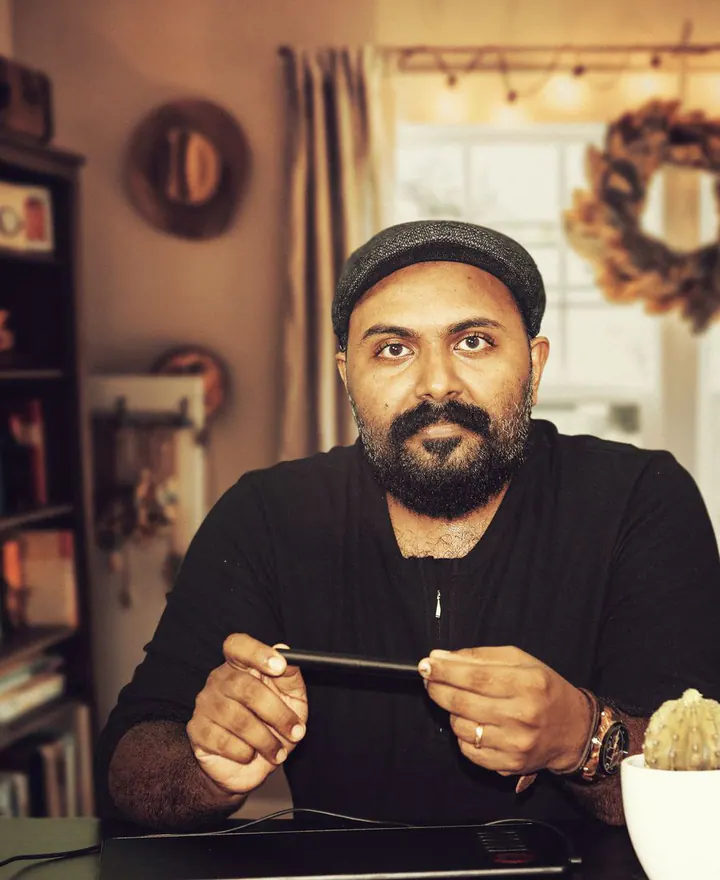An Indian consultant working at his desk