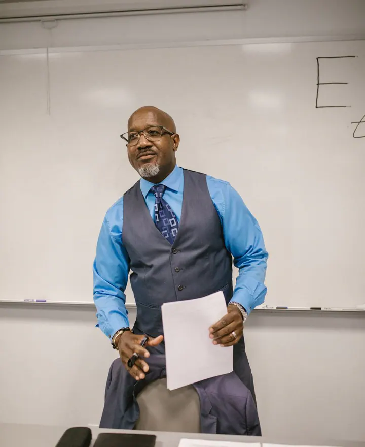 An experienced professor leading a university session