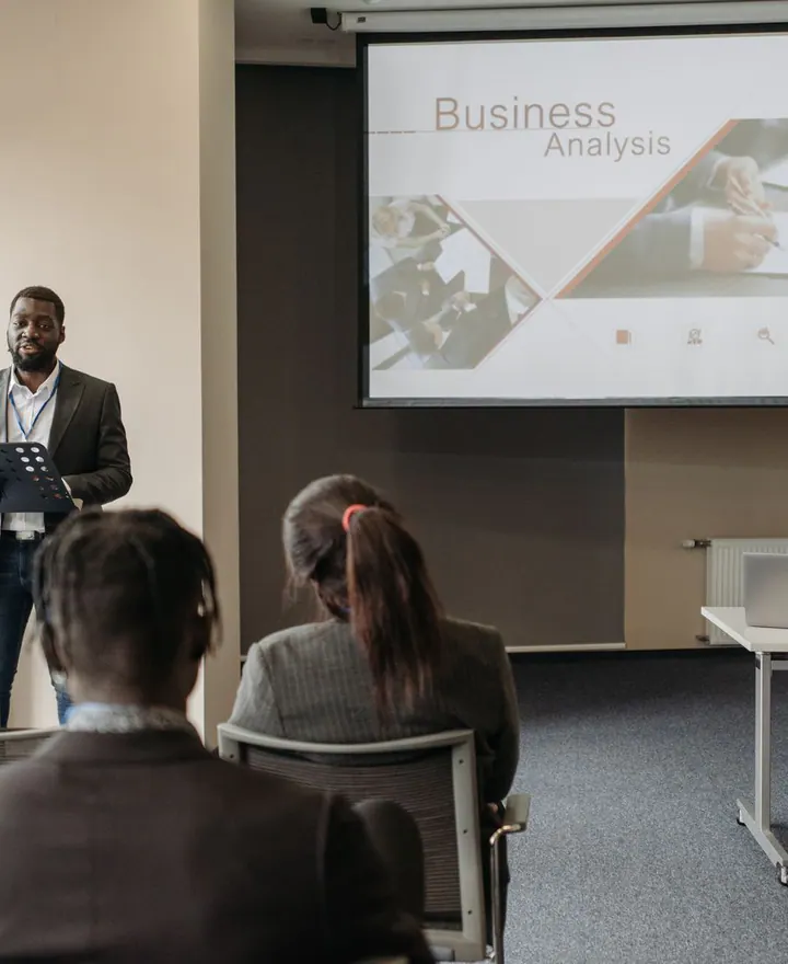 A professional trainer presenting at a business seminar